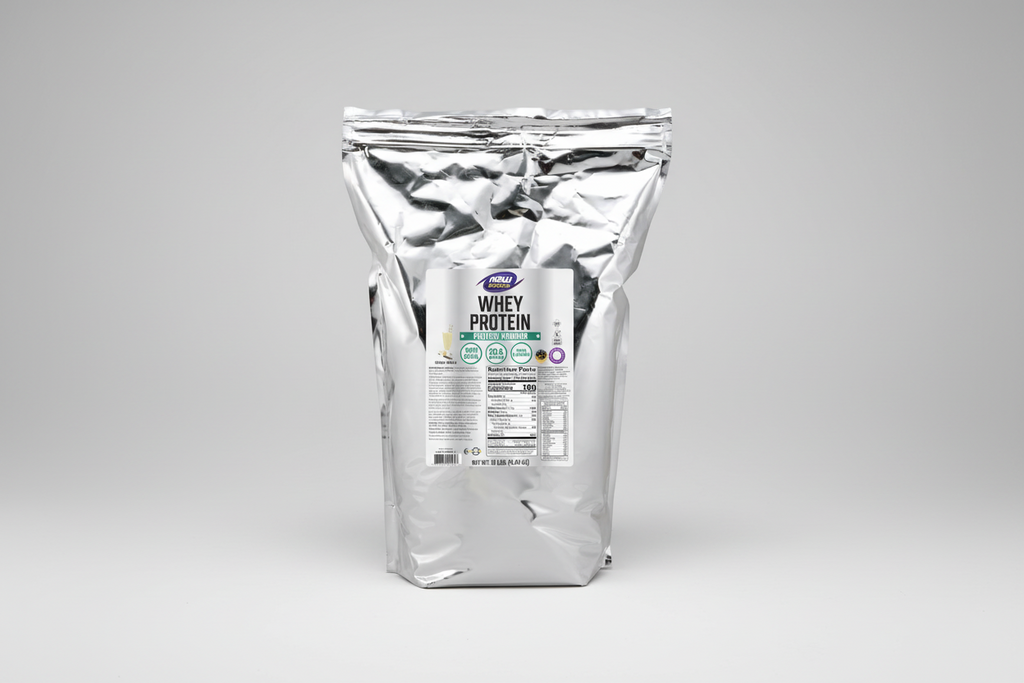 Clear bag of whey protein powder with a label on a white background