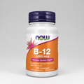 B-12 supplement bottle with purple cap and orange label on a white background