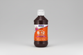 Bottle of NOW Liquid B-12 B-Complex supplement on a white background