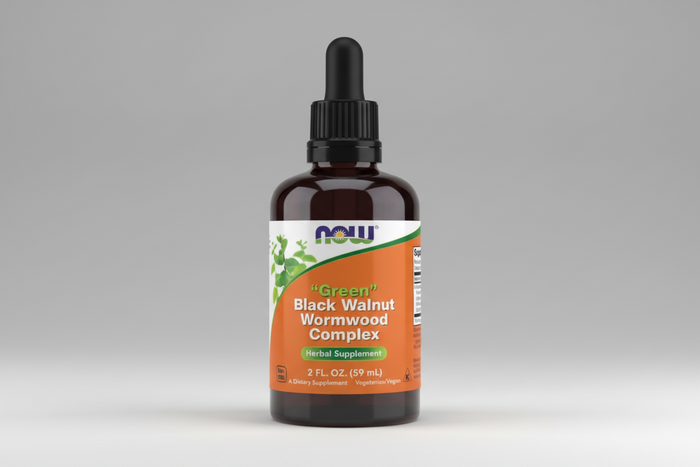 Herbal supplement bottle labeled 'Green Black Walnut Wormwood Complex' with Now brand on an orange background.