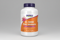 Supplement bottle labeled 'C-1000 Zinc Immune' with Now brand on a white background