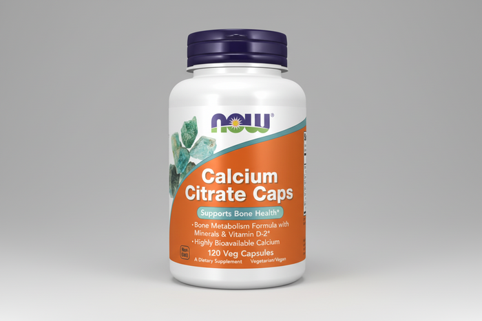 Supplement bottle labeled 'Calcium Citrate Caps' by NOW on a white background