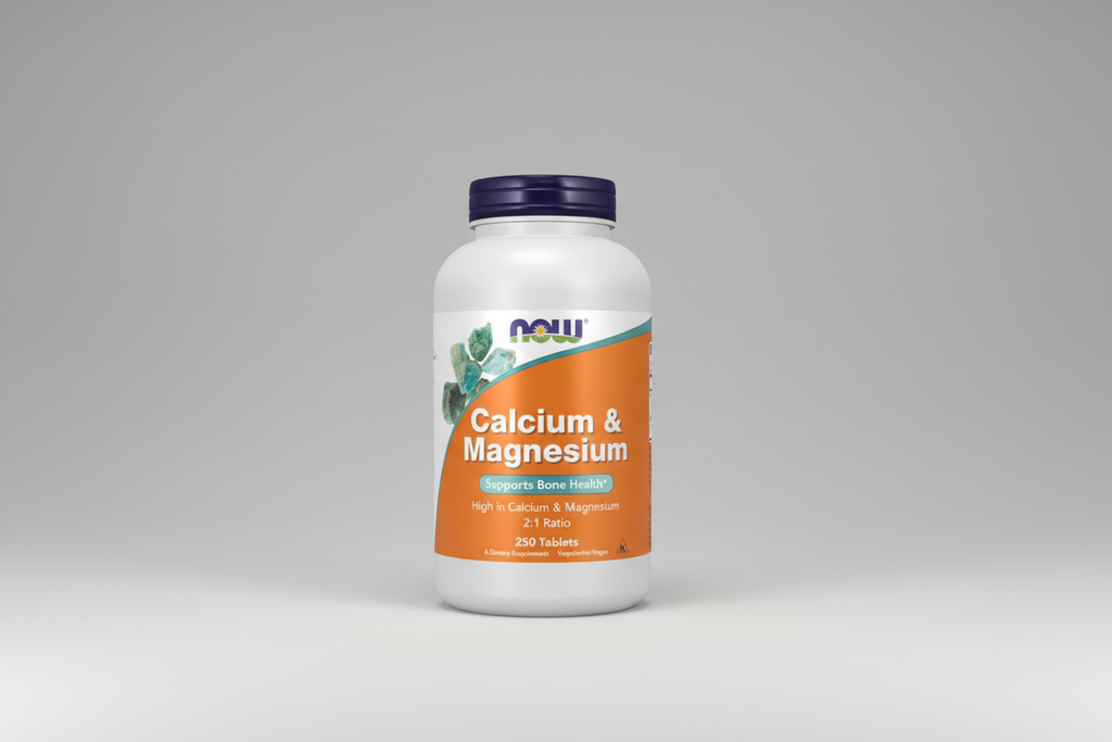 Supplement bottle labeled 'Calcium & Magnesium' by NOW on a white background