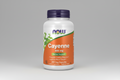 Supplement bottle labeled 'Cayenne' with Now brand logo on an orange background