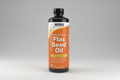 Bottle of NOW Flax Seed Oil on a white background