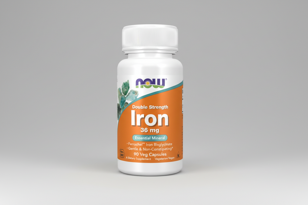 Bottle of NOW Iron supplement on a white background