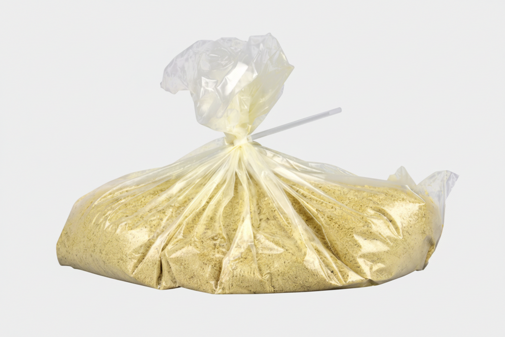 Bag of yellow sand or gravel with a white background