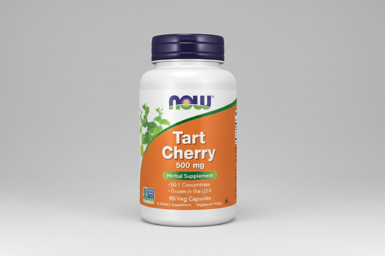 Supplement bottle labeled 'Tart Cherry 500 mg' by NOW on an orange background