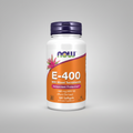 Supplement bottle labeled 'E-400' with NOW brand on a white background