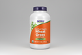 Container of NOW Certified Organic Wheat Grass Pure Powder on a white background