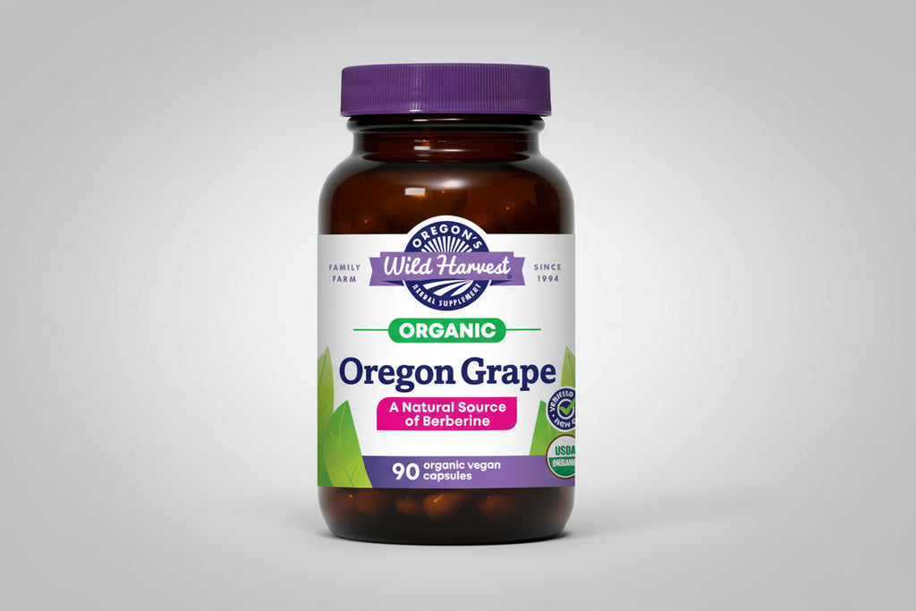 Oregon Grape supplement bottle with purple cap and label on a black background