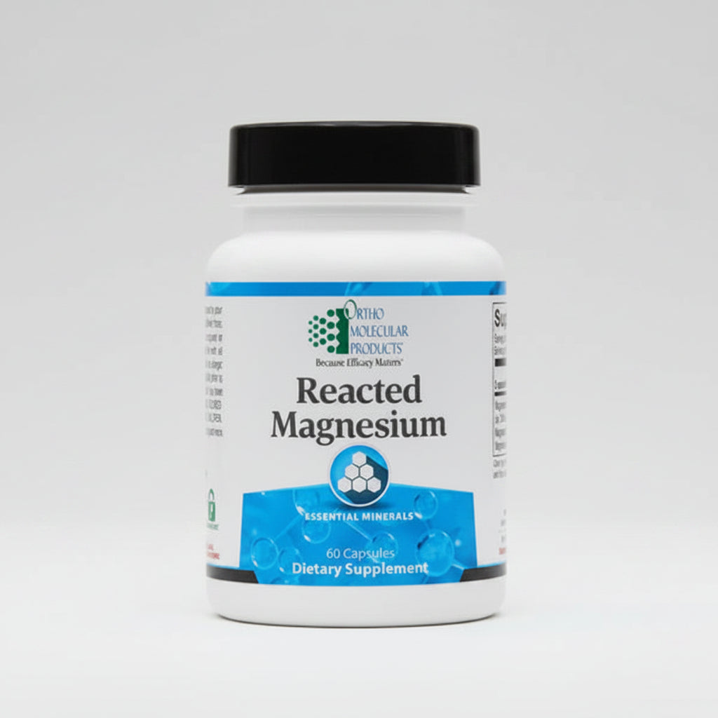 Supplement bottle labeled 'Reacted Magnesium' by Ortho Molecular Products on a white background