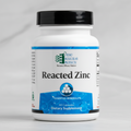Supplement bottle labeled 'Reacted Zinc' by Ortho Molecular Products on a white background