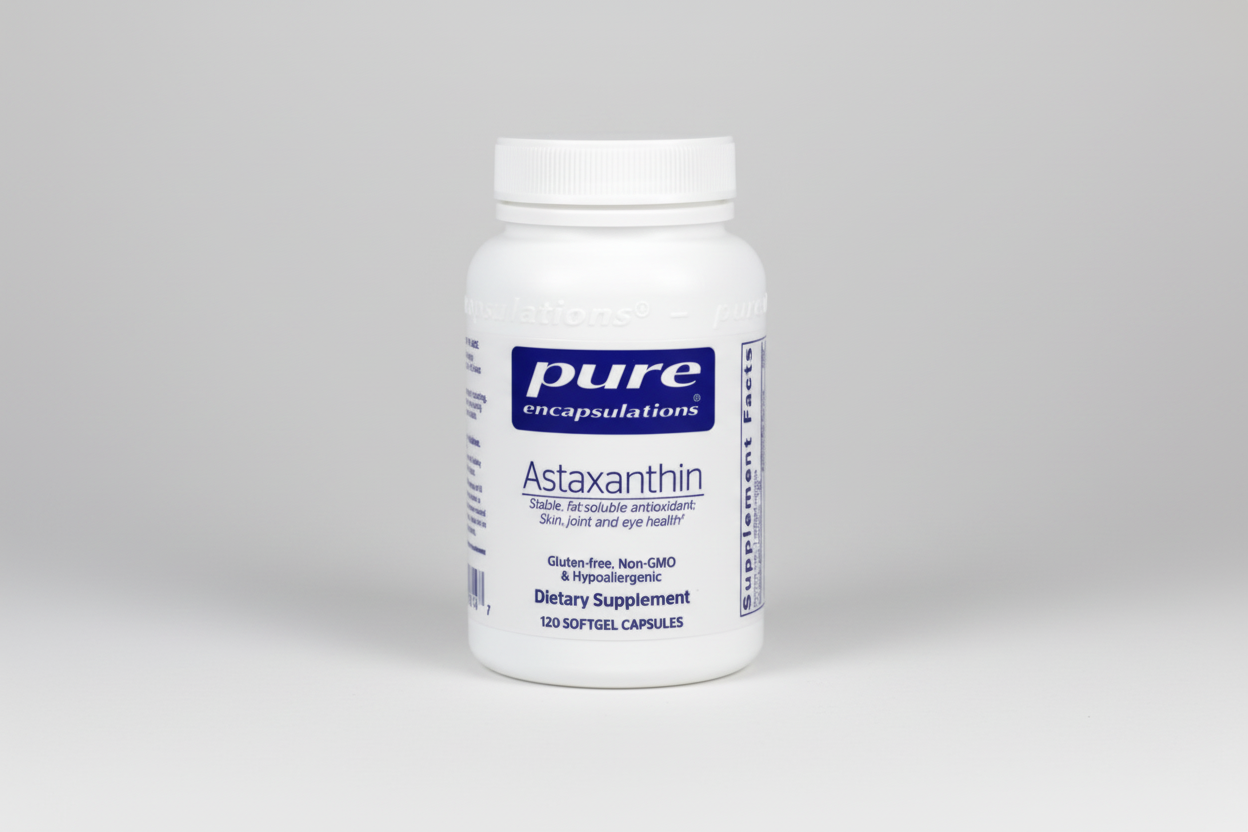 Supplement bottle labeled 'pure encapsulations Astaxanthin' on a white background