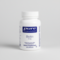 Bottle of Pure Encapsulations Biotin supplement on a white background