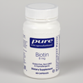 Bottle of Pure Encapsulations Biotin supplement on a white background