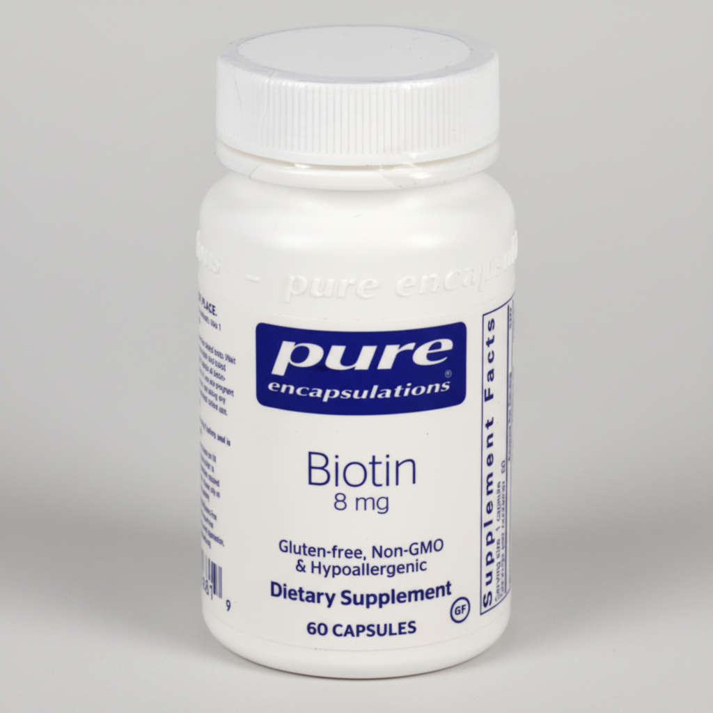 Bottle of Pure Encapsulations Biotin supplement on a white background