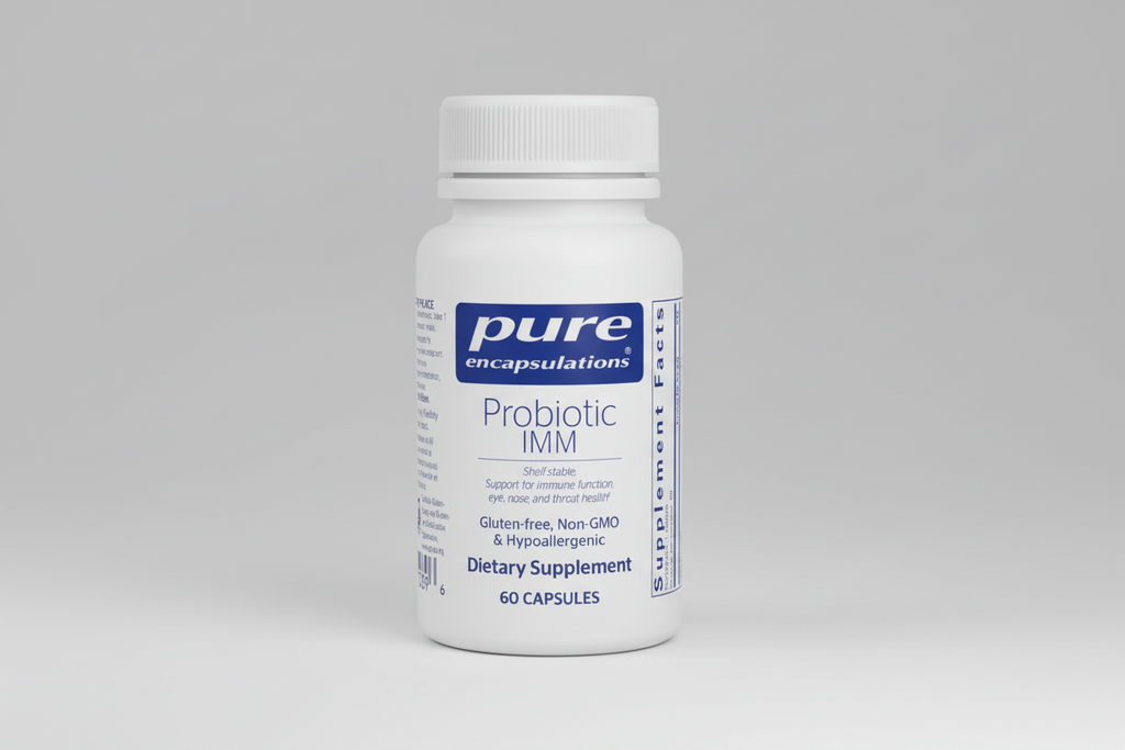 White bottle of pure encapsulations Probiotic IMM supplement on a white background