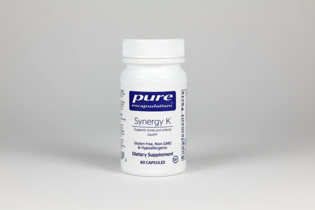 Supplement bottle labeled 'Synergy K' by Pure Encapsulations on a white background