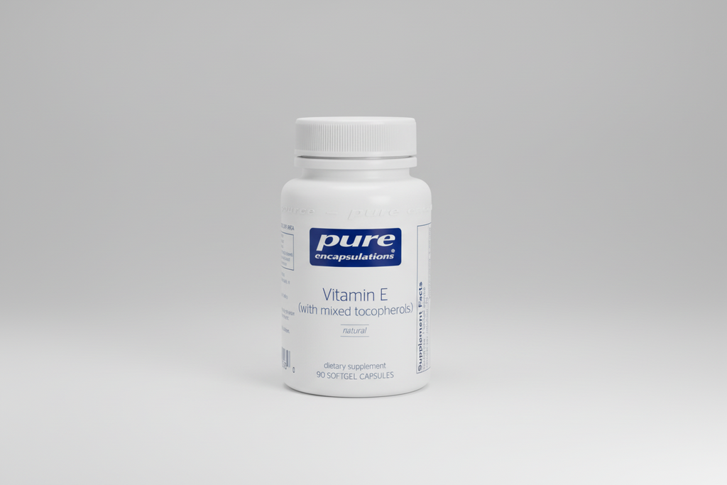 White supplement bottle labeled 'pure encapsulations Vitamin E' on a white background