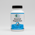 Supplement bottle labeled 'Reacted Magnesium' by Ortho Molecular Products on a white background