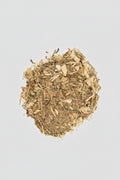 Heap of dried herbs on a white background
