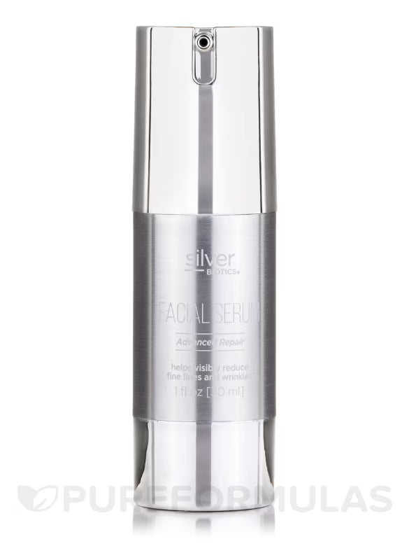 Silver facial serum bottle on a white background