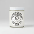 Jar of Midwest Vitamins tallow cream on a wooden surface with a white background