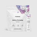 Thorne Amino Complex supplement package with berry flavor on a black background