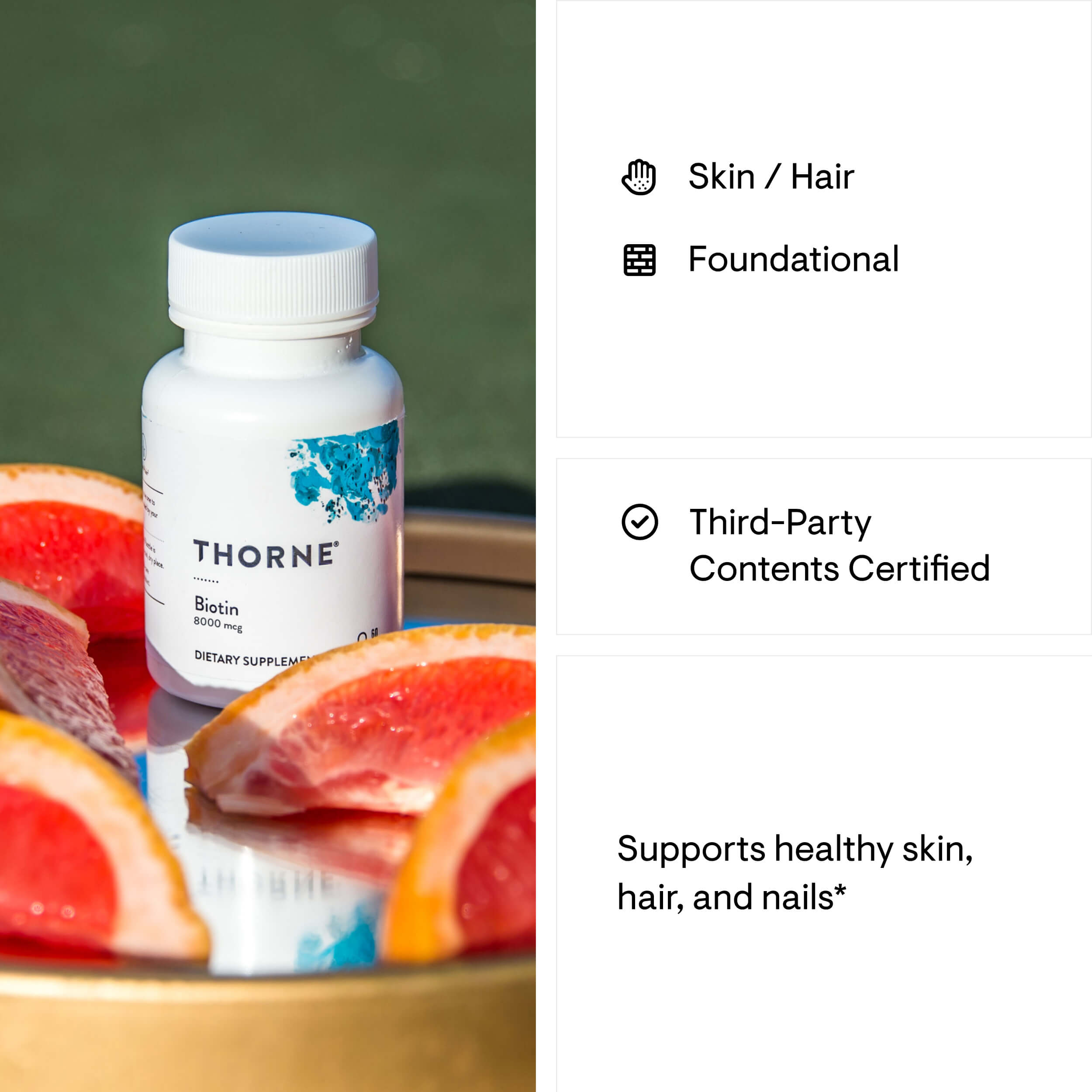 Thorne Biotin supplement bottle with grapefruit slices on a reflective surface
