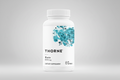 Thorne Biotin supplement bottle on a white background