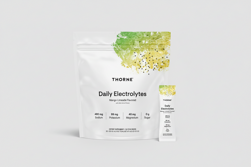 Thorne Daily Electrolytes package with a smaller pack on a black background