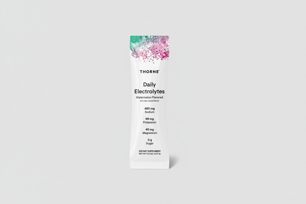 Thorne Daily Electrolytes supplement package on a black background