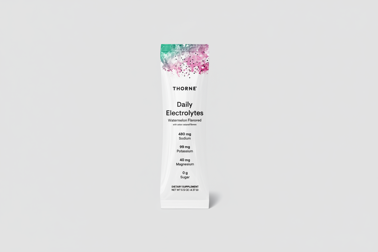 Thorne Daily Electrolytes supplement package on a black background