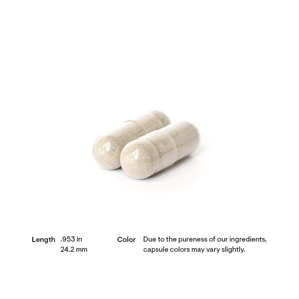 Two white capsules on a white background with text about dimensions and color variation.