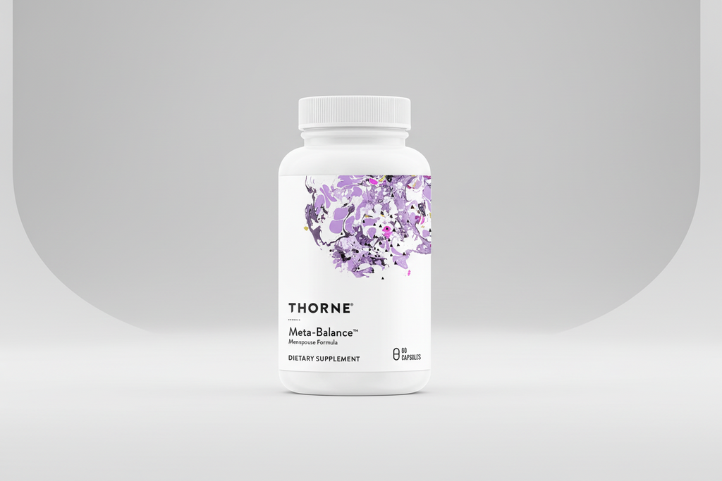 Thorne Meta-Balance dietary supplement bottle on a black background