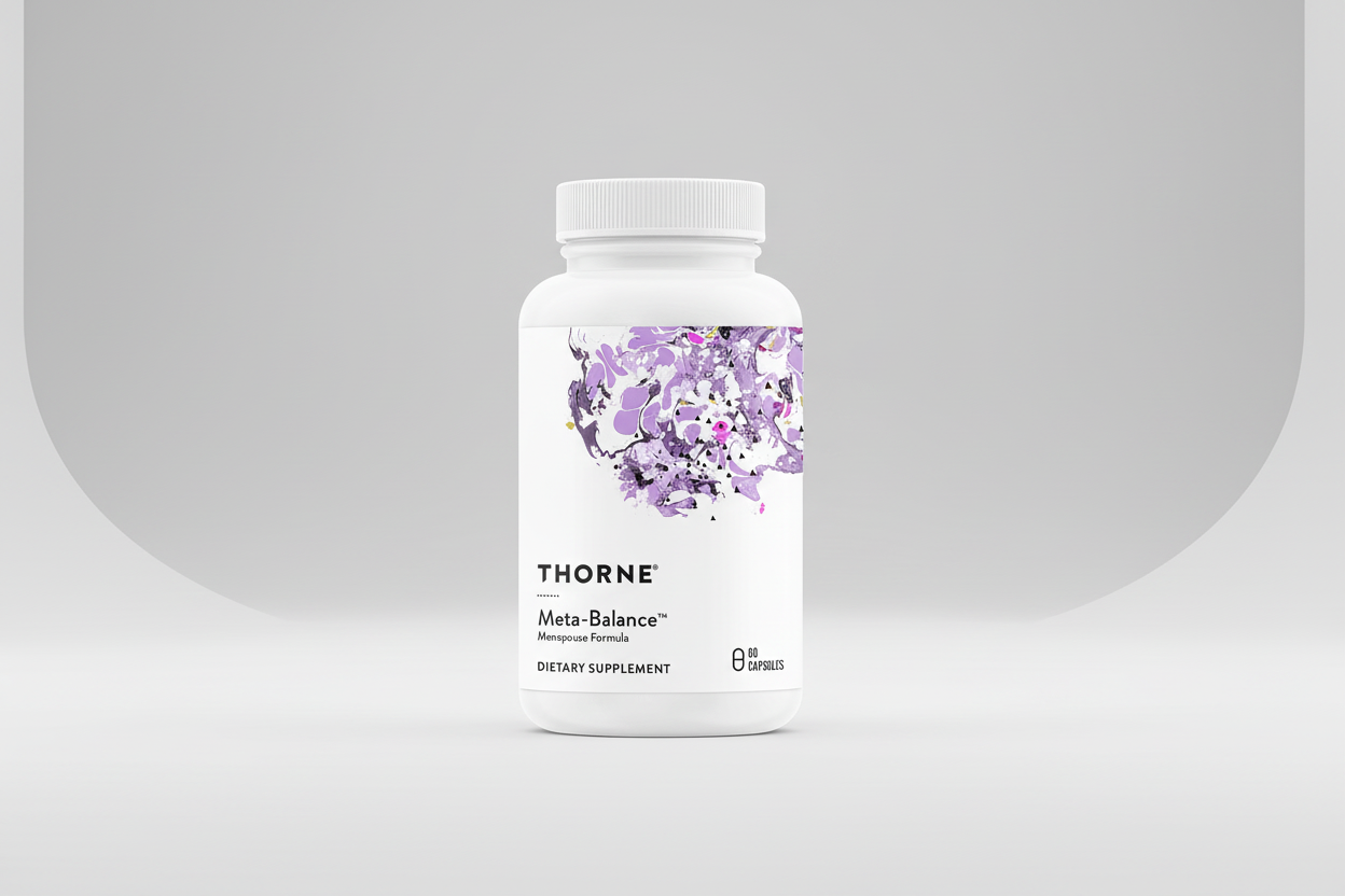 Thorne Meta-Balance dietary supplement bottle on a black background