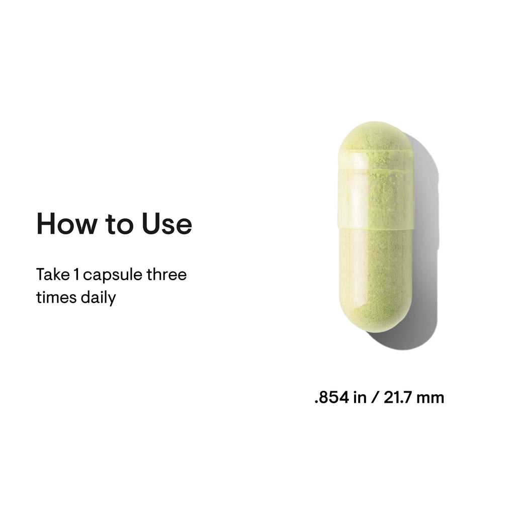 Green capsule pill with usage instructions on a white background