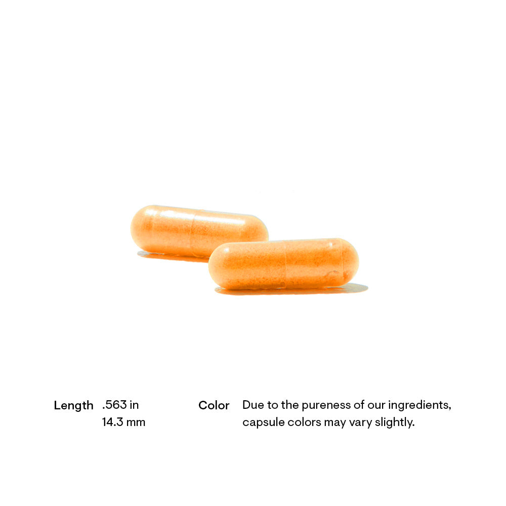 Two orange capsules on a white background with text about dimensions and color variation.