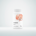 Thorne S.A.T. dietary supplement bottle with floral design on a black background