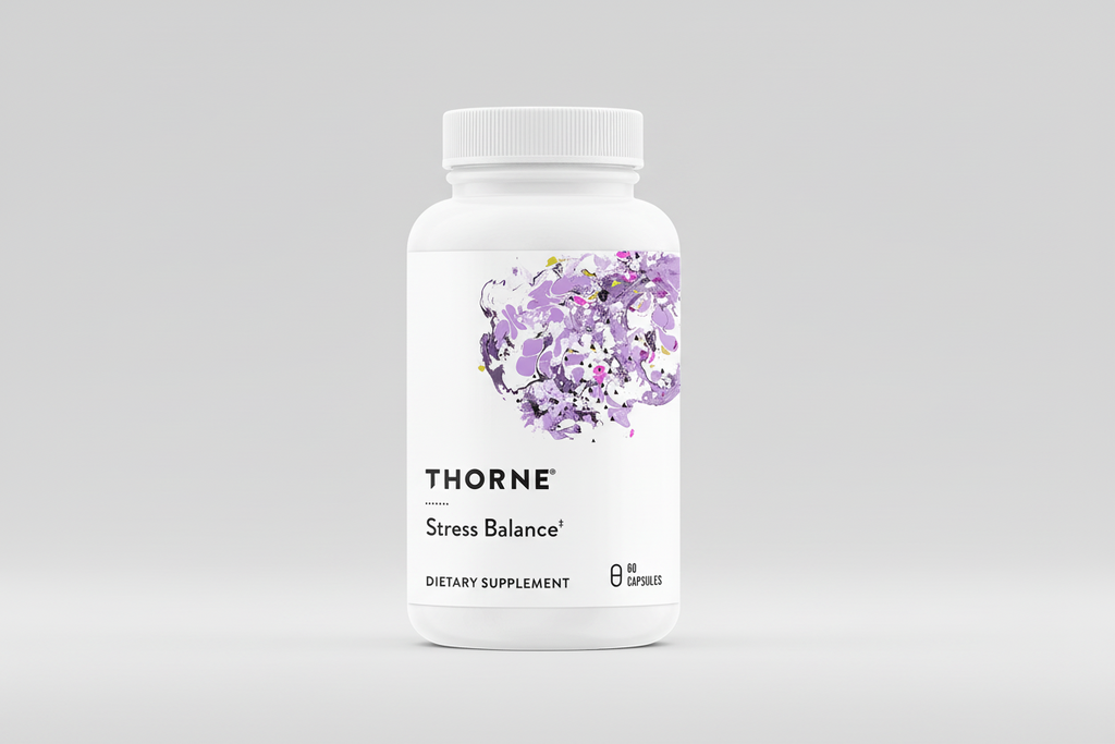 Thorne Stress Balance dietary supplement bottle on a black background