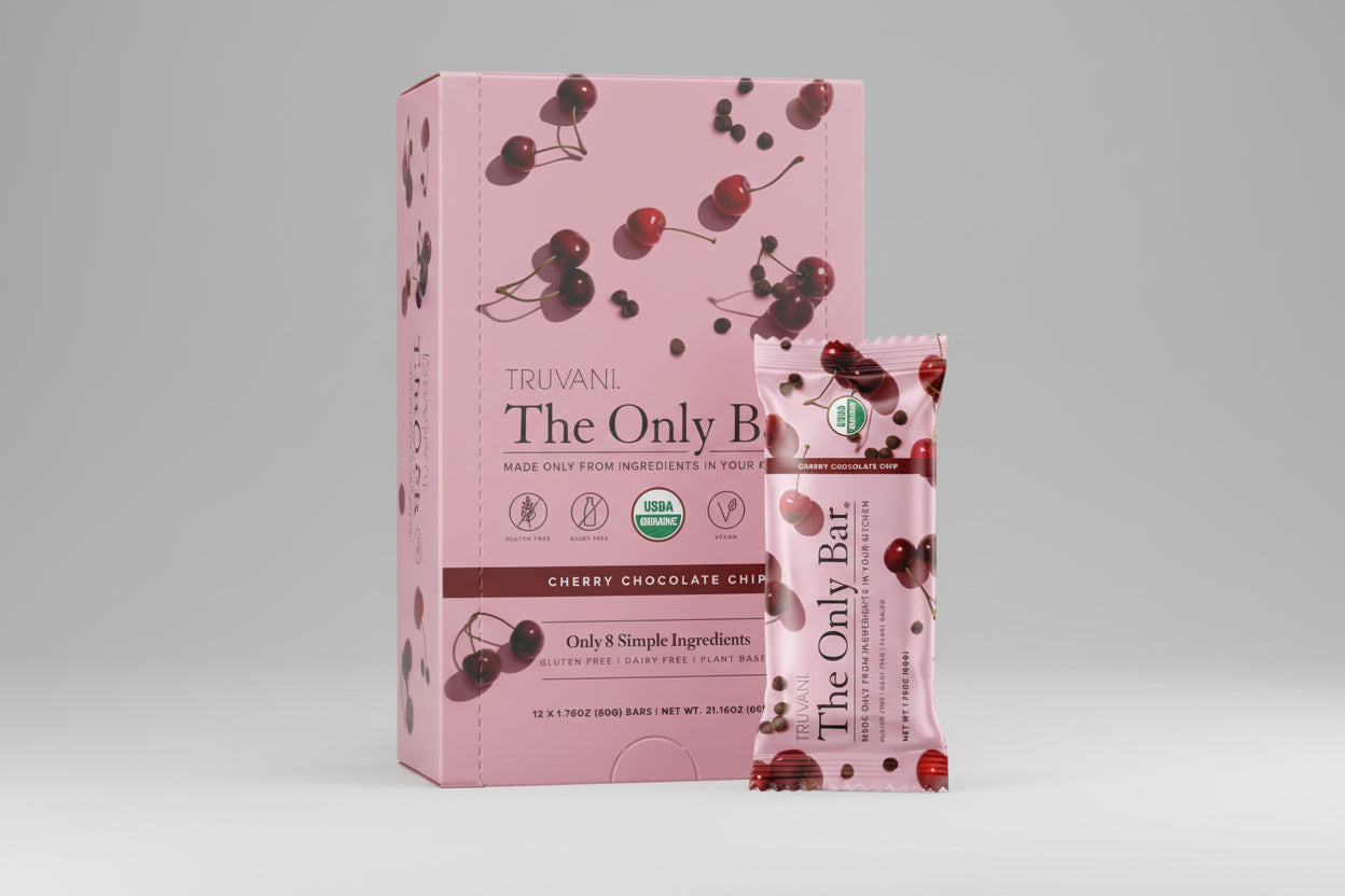 Truvani Cherry Chocolate Chip bar packaging with cherry design on a pink background