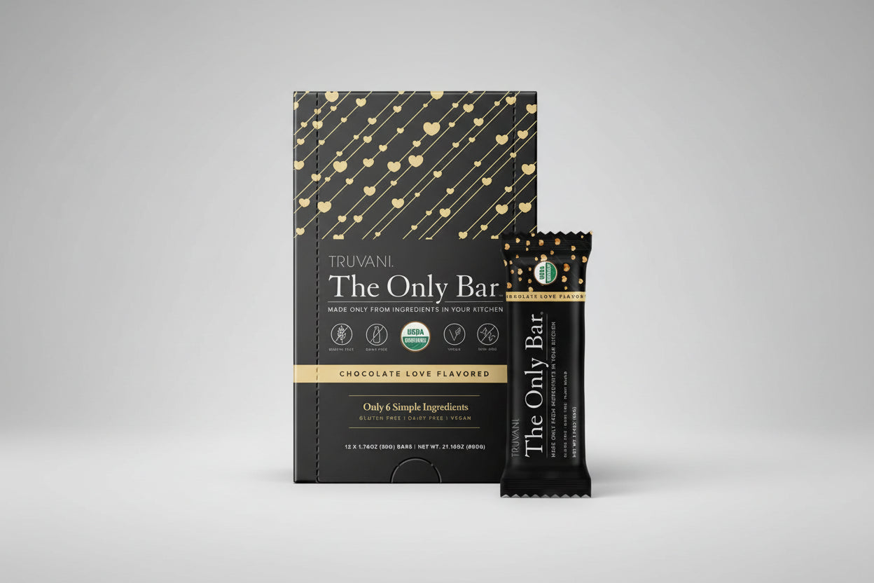 Truvani The Only Bar packaging with gold heart patterns on a black background