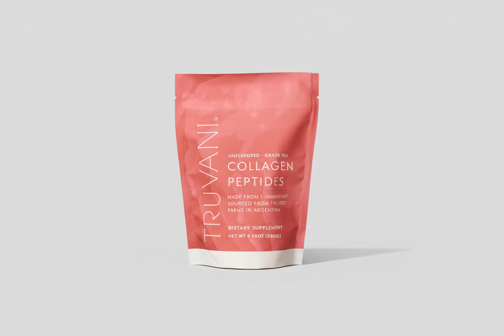 Person holding a pink package of Truvani Collagen Peptides