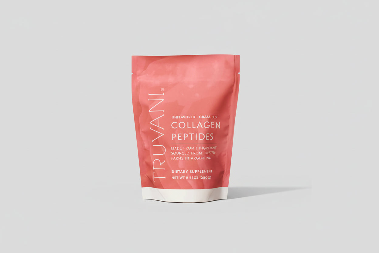 Person holding a pink package of Truvani Collagen Peptides
