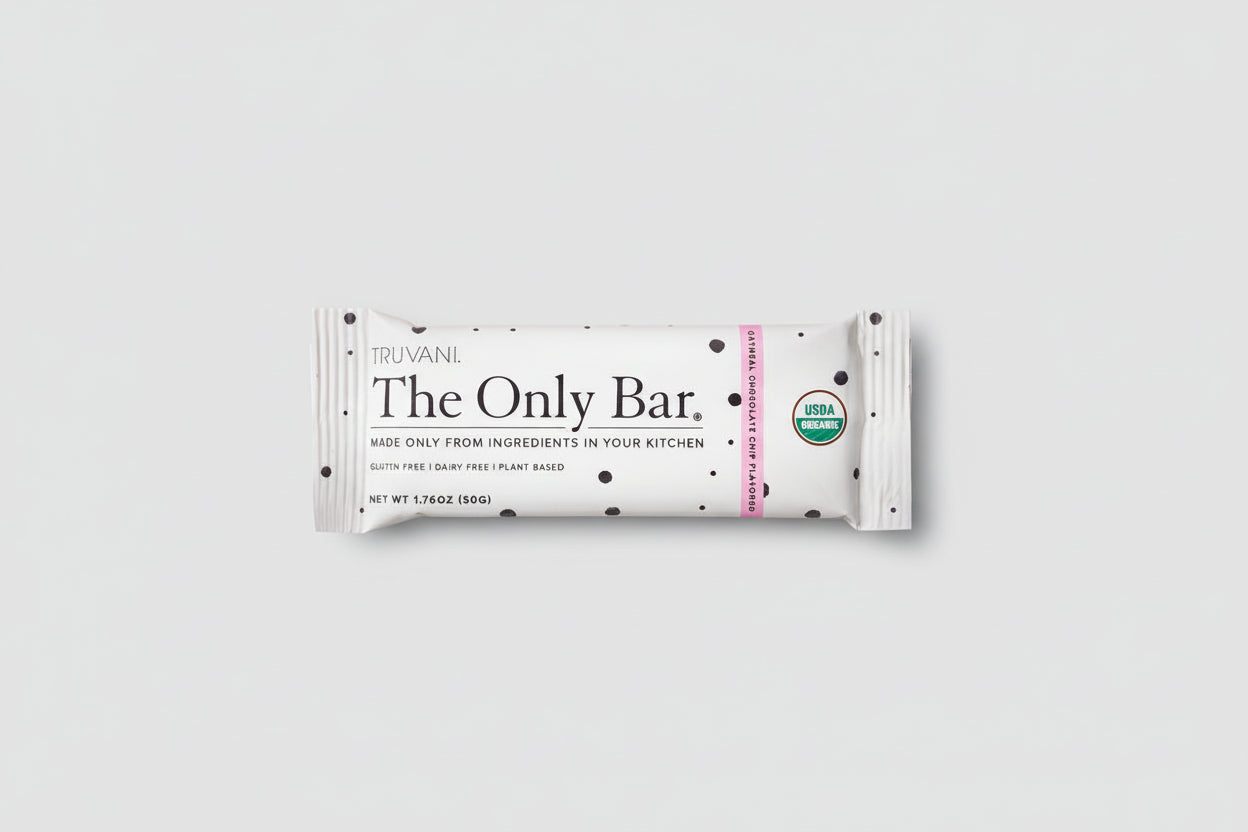 Truvani The Only Bar on a bed of cookies with visible USDA Organic labels.