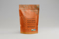 Truvani pumpkin spice plant-based protein powder package on a white background