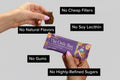 Person holding a 'The Only Bar' with text highlighting ingredients.