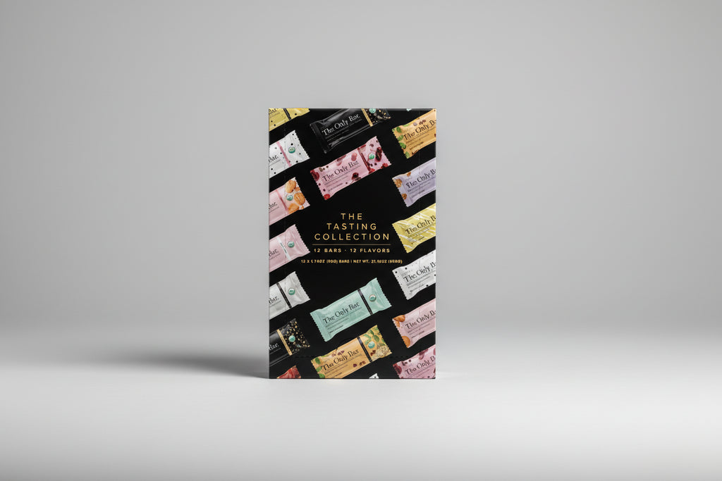 Box of 'The Tasting Collection' with various flavor packaging on a white background
