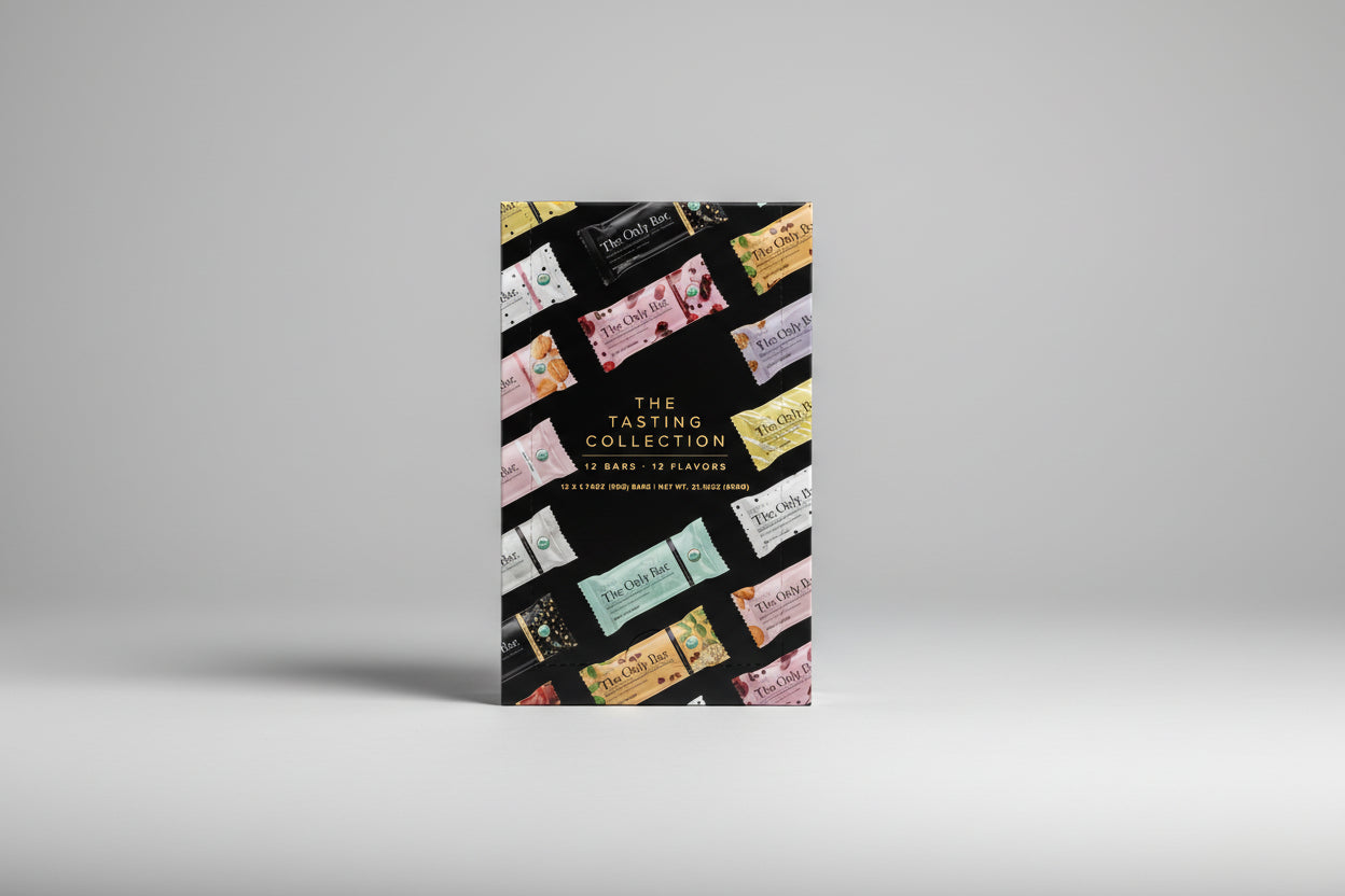 Box of 'The Tasting Collection' with various flavor packaging on a white background